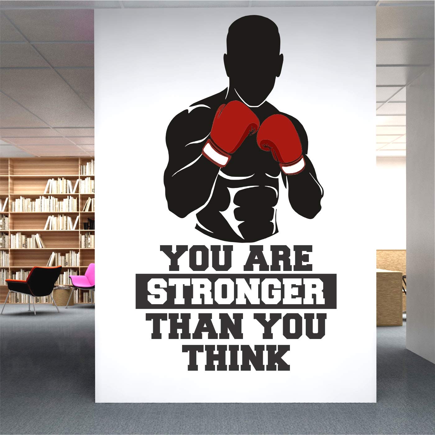 Motivational poster with boxing silhouette and text in an office setting