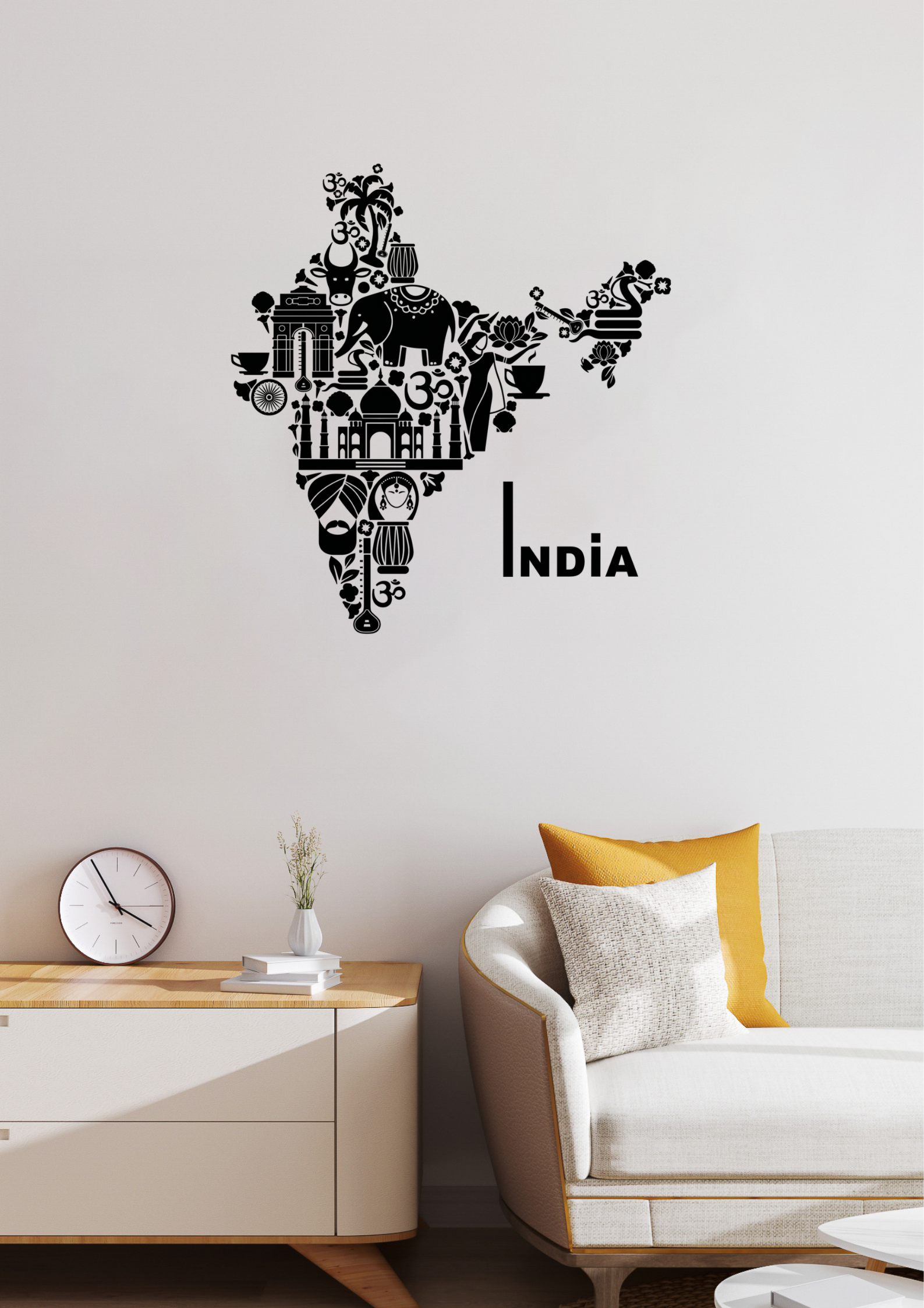 Wall decal of a map of India with cultural icons on a wall above a sofa.