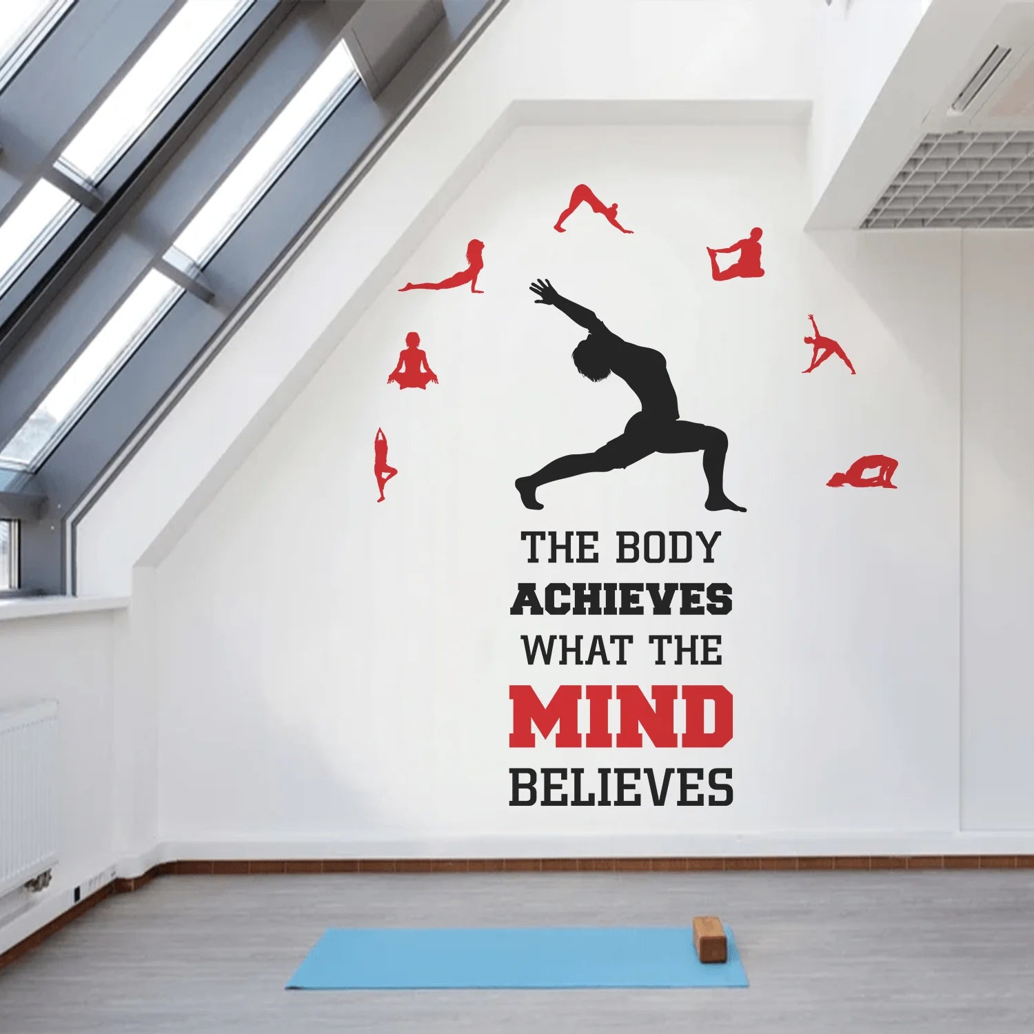 Yoga-themed wall decal with motivational quote in a modern room.