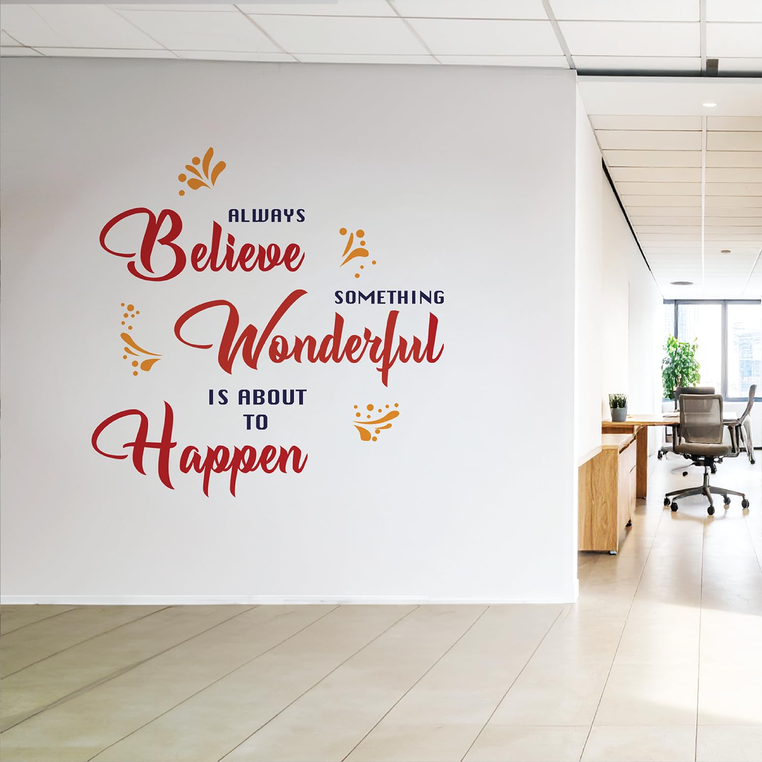 Motivational quote on a wall in an office setting