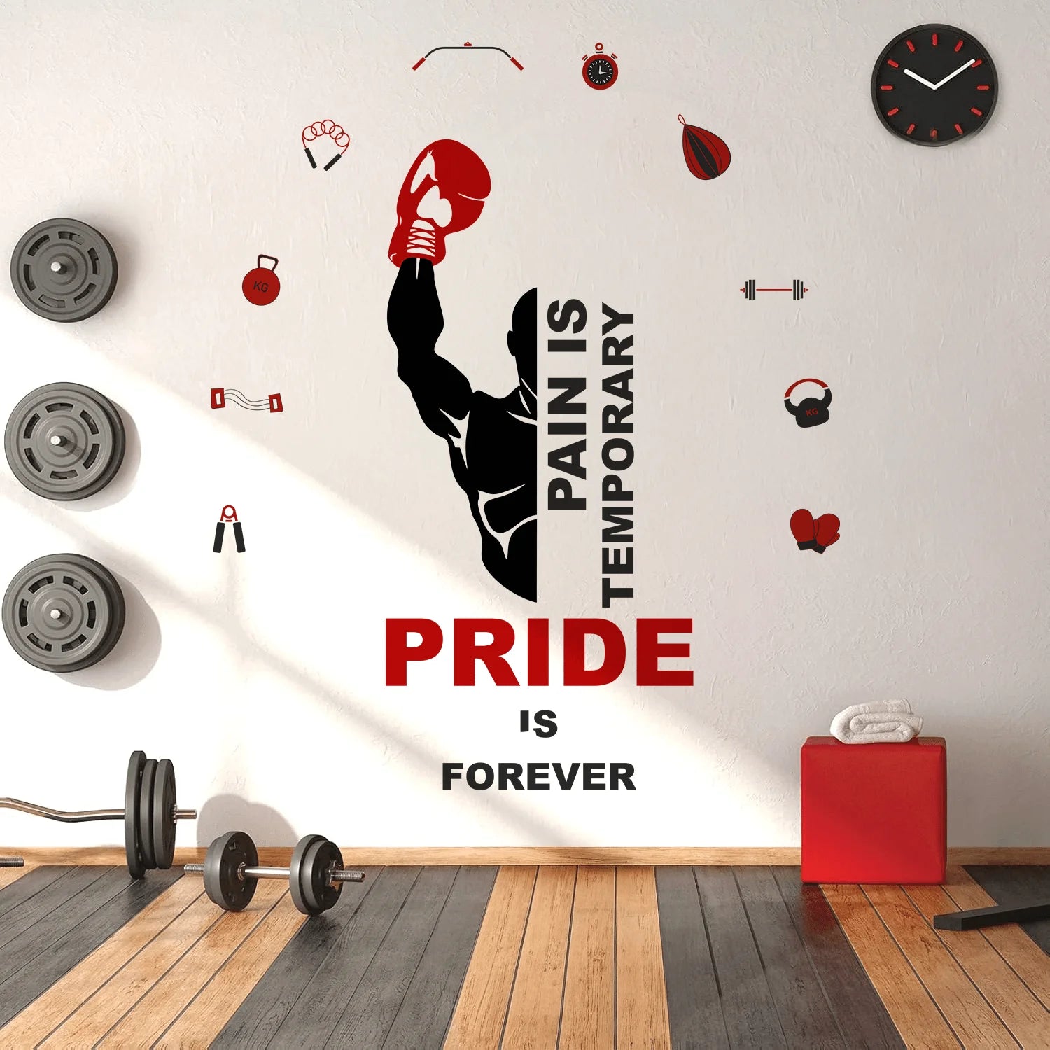 Gym interior with motivational wall decal and fitness equipment.