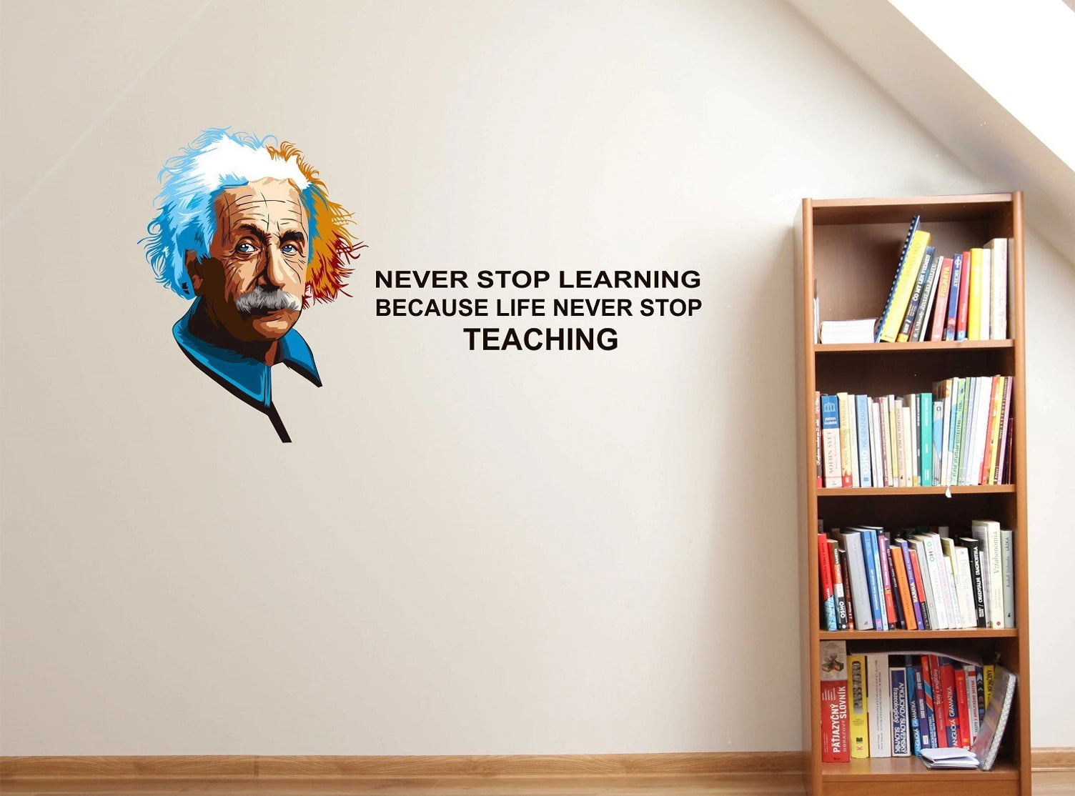 Wall decal of a famous Albert Einstein with a motivational quote next to a bookshelf.