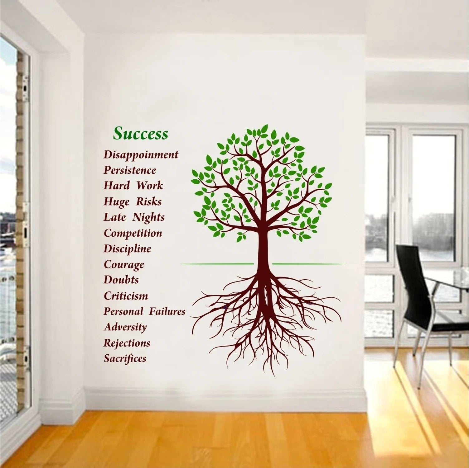 Wall decal of a tree with motivational text on a wall in a room with large windows.