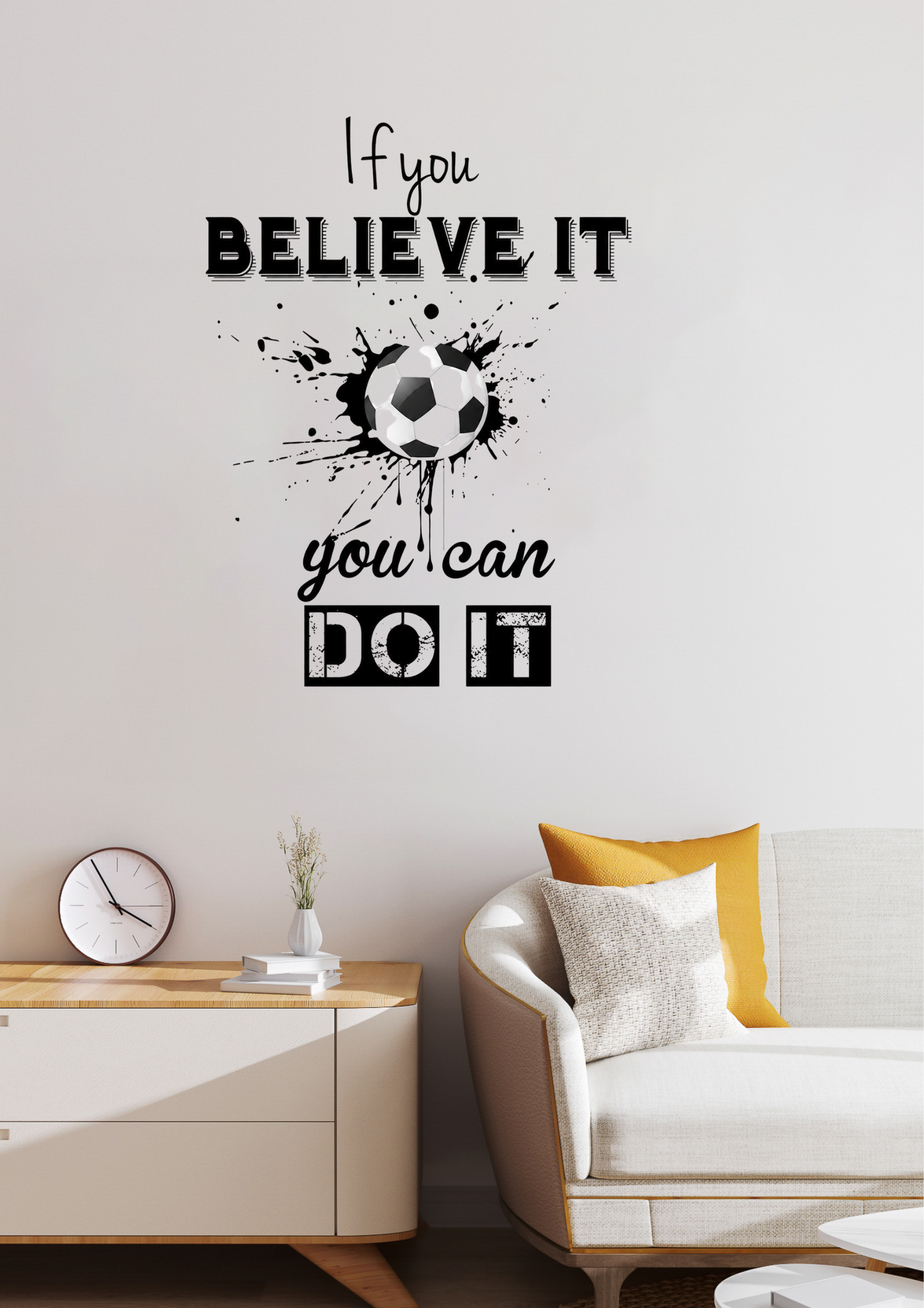Wall decal with motivational quote and soccer ball design in a living room.