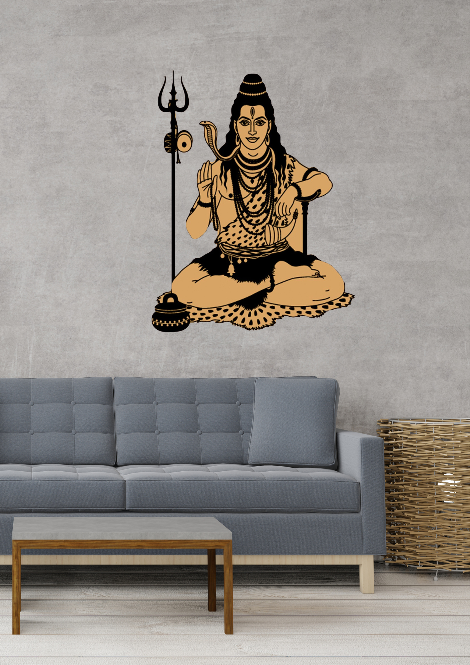 Wall decal of a seated Shiva with a trident on a gray wall above a gray sofa.