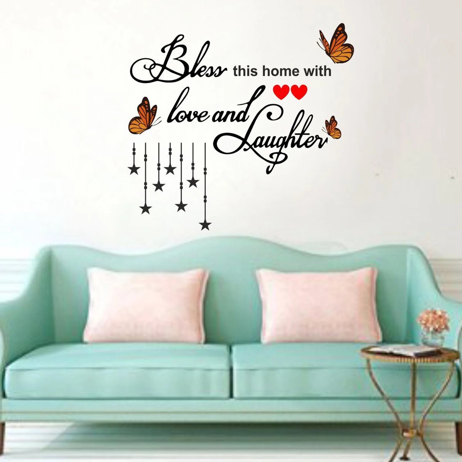 Wall decal with decorative text and butterflies on a light blue sofa background