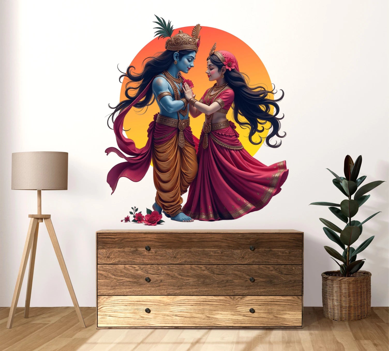 Wall decal of Radha Krishna in traditional attire on a wall above a wooden dresser.