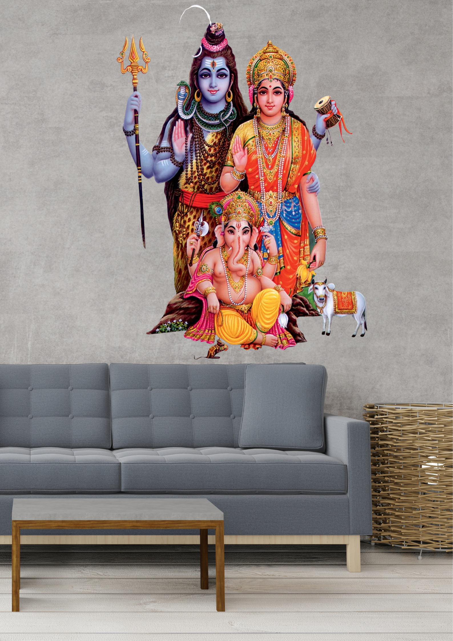 Wall decal of Shiv Parivar wall art featuring Lord Shiva, Goddess Parvati, and Lord Ganesha on a gray wall above a sofa