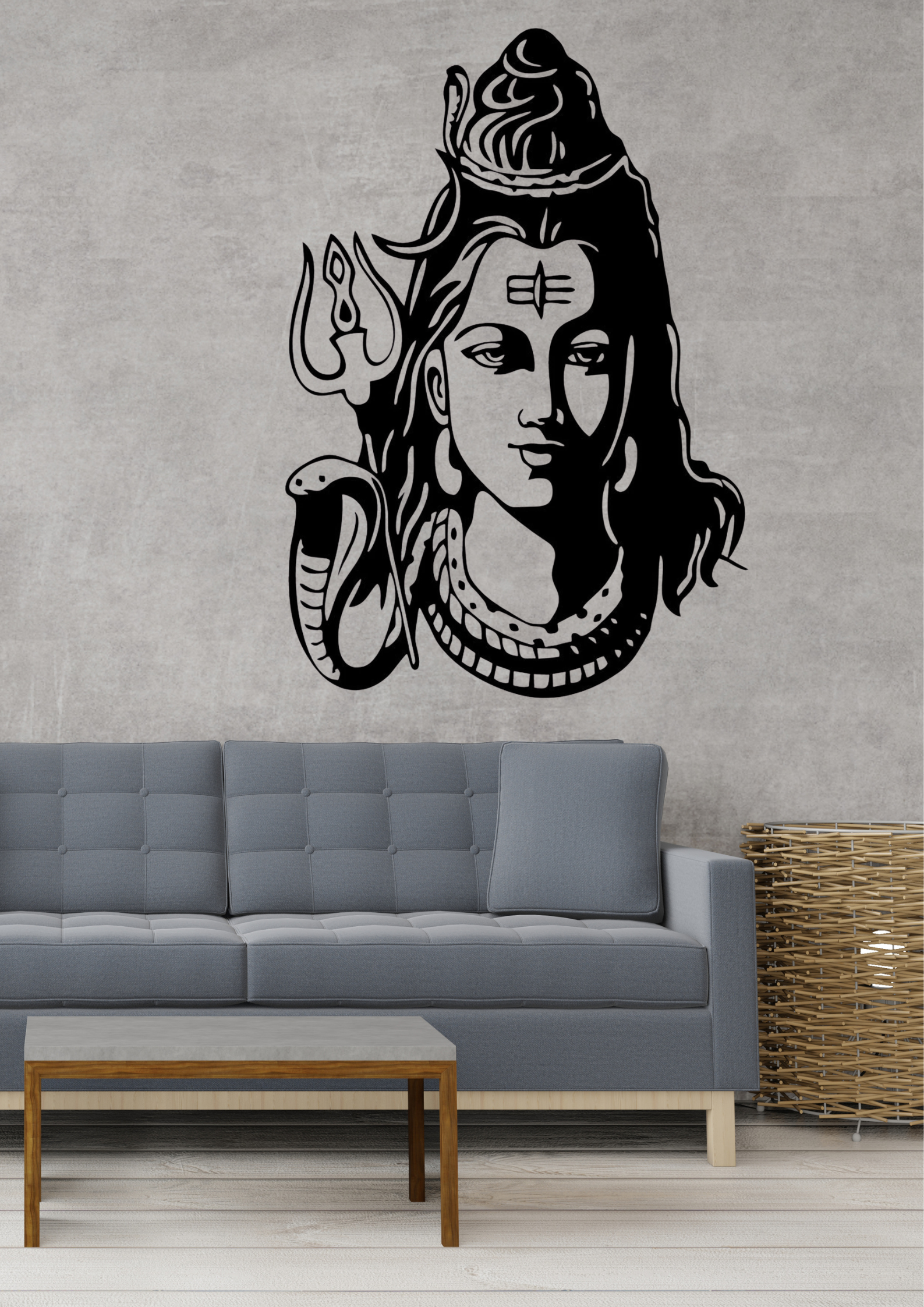 Wall decal of a Shiva head on a gray wall above a gray sofa.