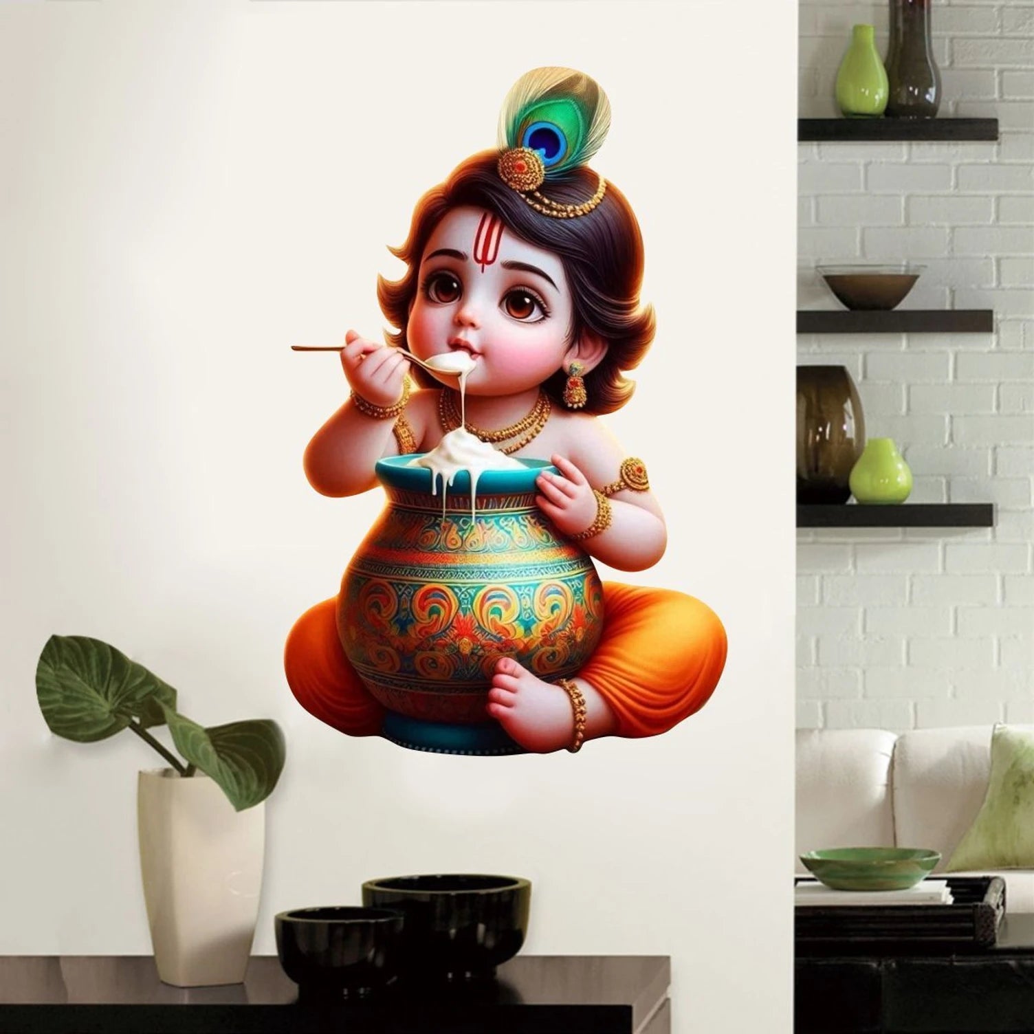 Wall decal of a Bal Krishna Eating Makhan with a spoon in a living room setting.