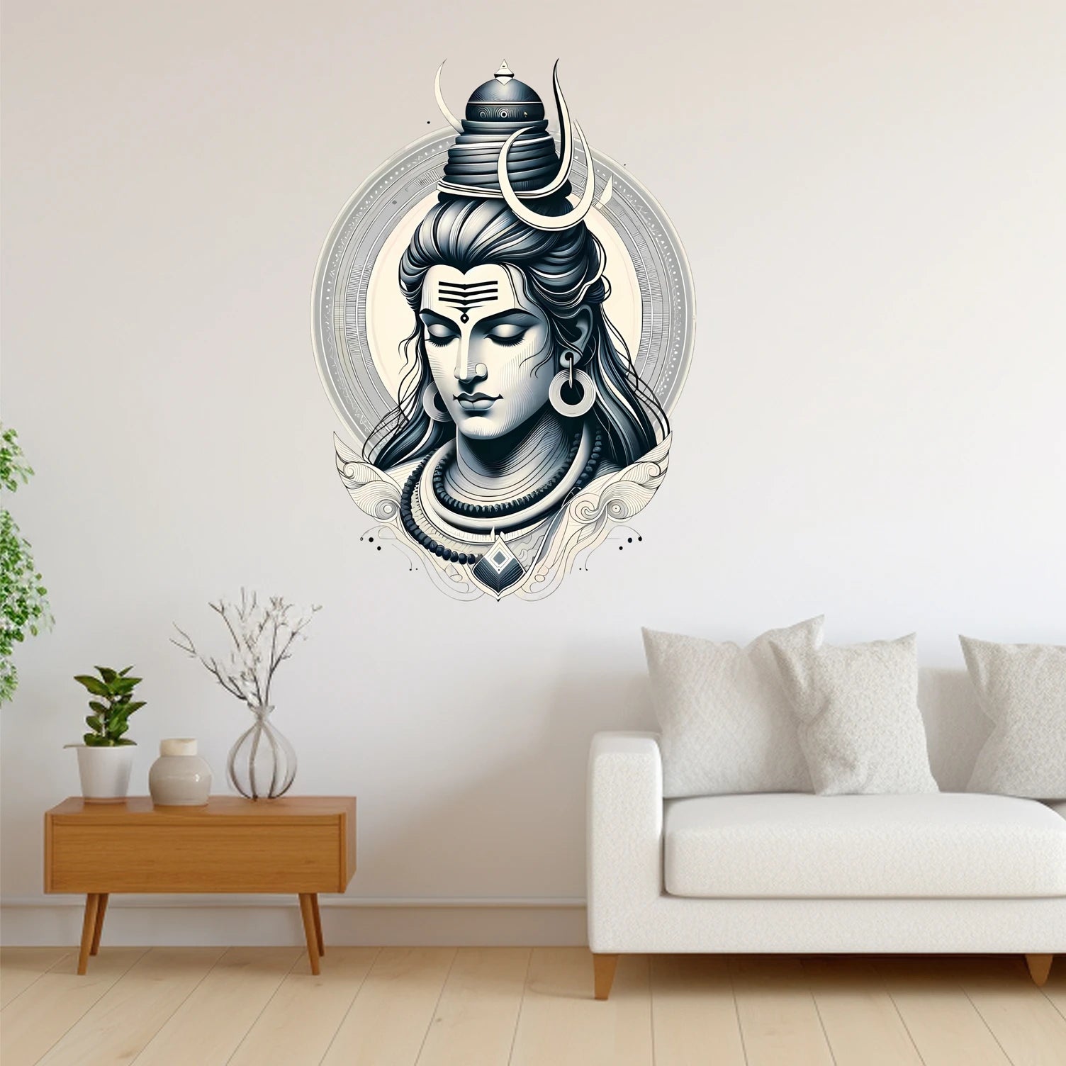 Decorative wall sticker of a stylized Mahadev face with horns in a living room setting.